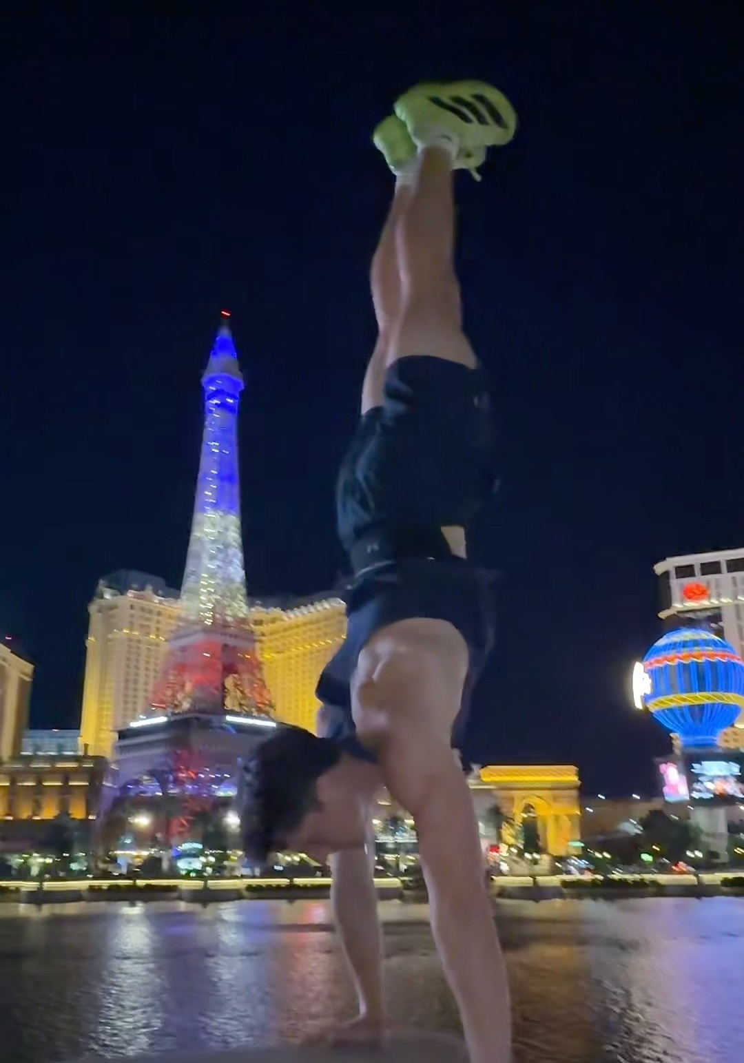 Carson Teagarden handstand on the Las Vegas Strip — photo Dennis Yu